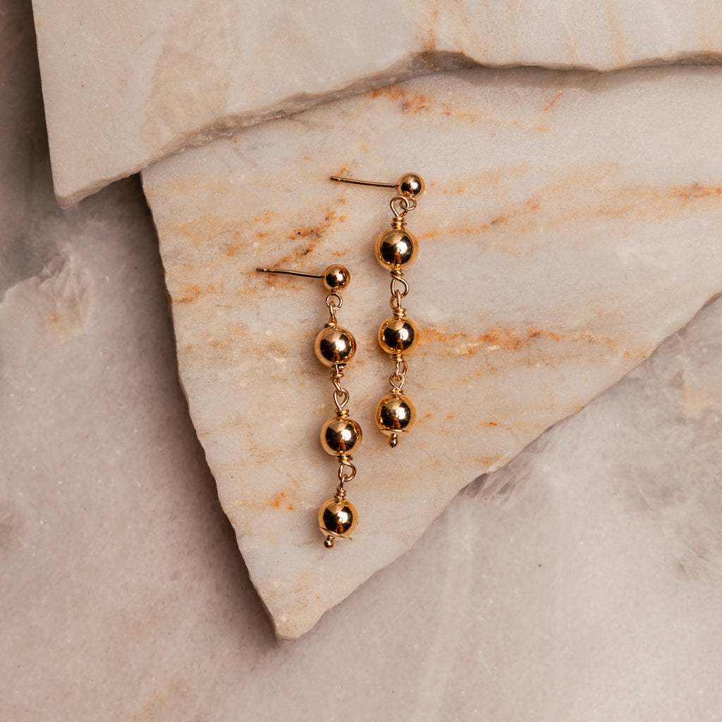 "French-inspired Bijou Earrings with graduated gold filled balls, perfect for sensitive ears."

