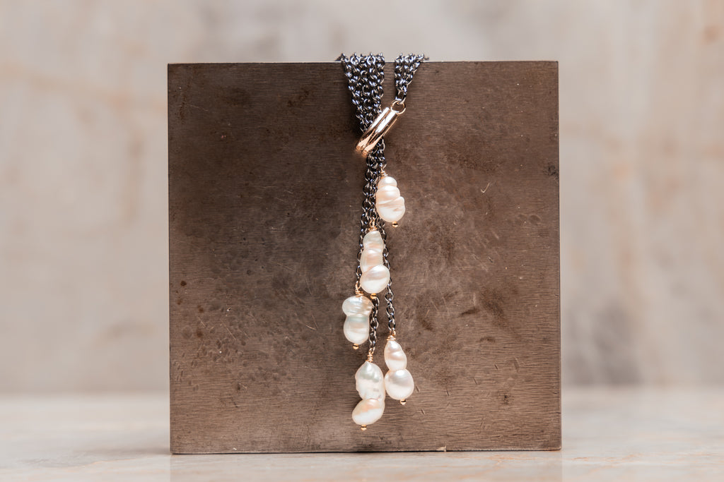 Calla Necklace: Dramatic dark chain with cascading white keshi pearls