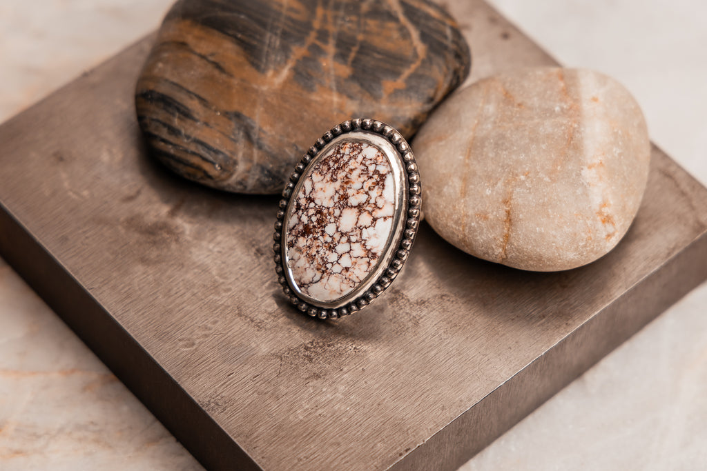 Boho-chic silver ring showcasing marbled white and brown wild horse magnesite stone