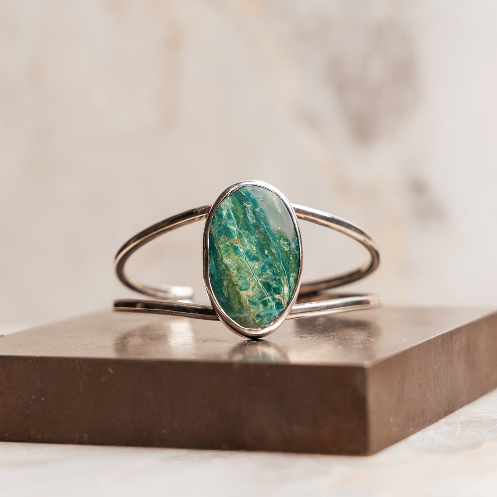 "Christabel Cuff Bracelet featuring a captivating blue Peruvian opal gemstone in a sterling silver setting."

