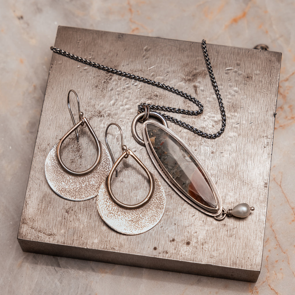 Artisanal silver necklace and earrings featuring rugged texture echoing Greek landscape One of a Kind jewelry