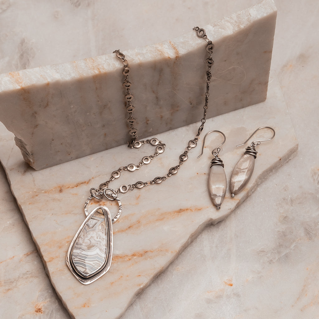 "Handcrafted sterling silver necklace featuring unique crazy lace agate and matte circle chain 

