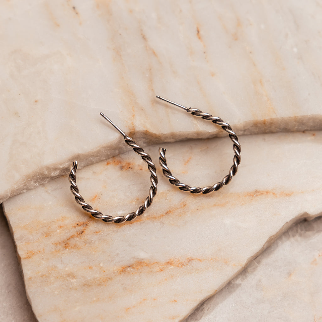 "Handcrafted Isa Sterling Silver Twisted Hoop Earrings, 1-inch drop, artisan made."

