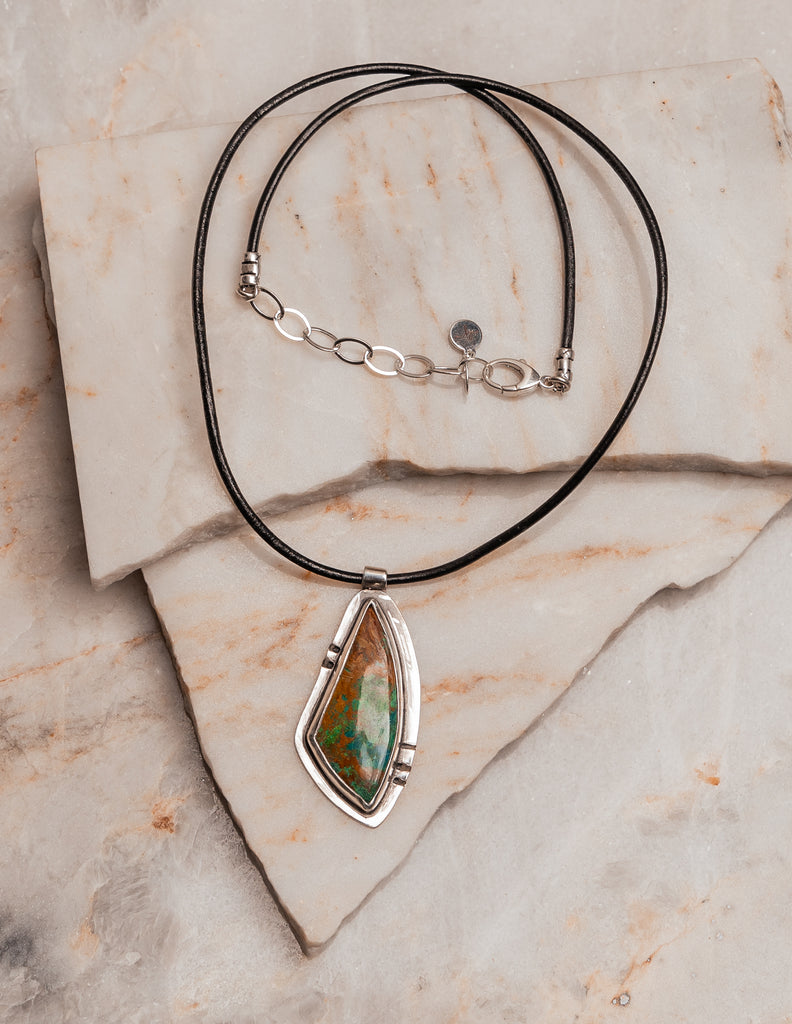 "Handcrafted sterling silver pendant with multicolored chrysocolla stone on black leather 

