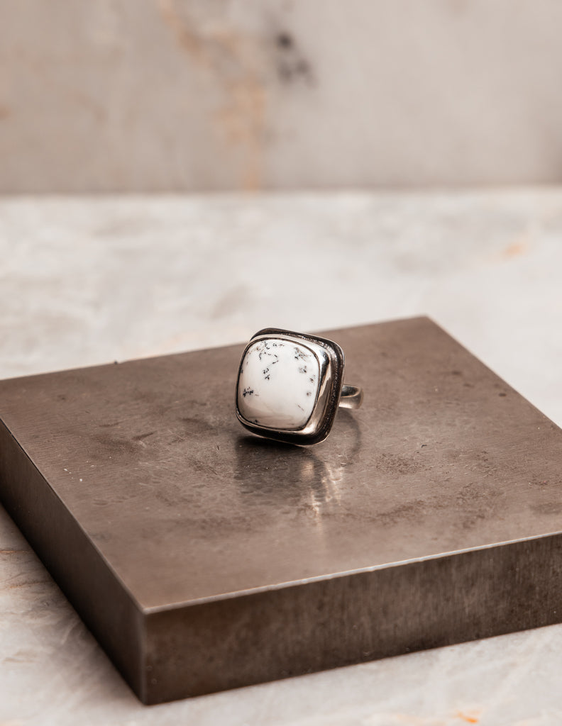 "One-of-a-kind Melina Ring with delicate black dendrite patterns in white opal."

