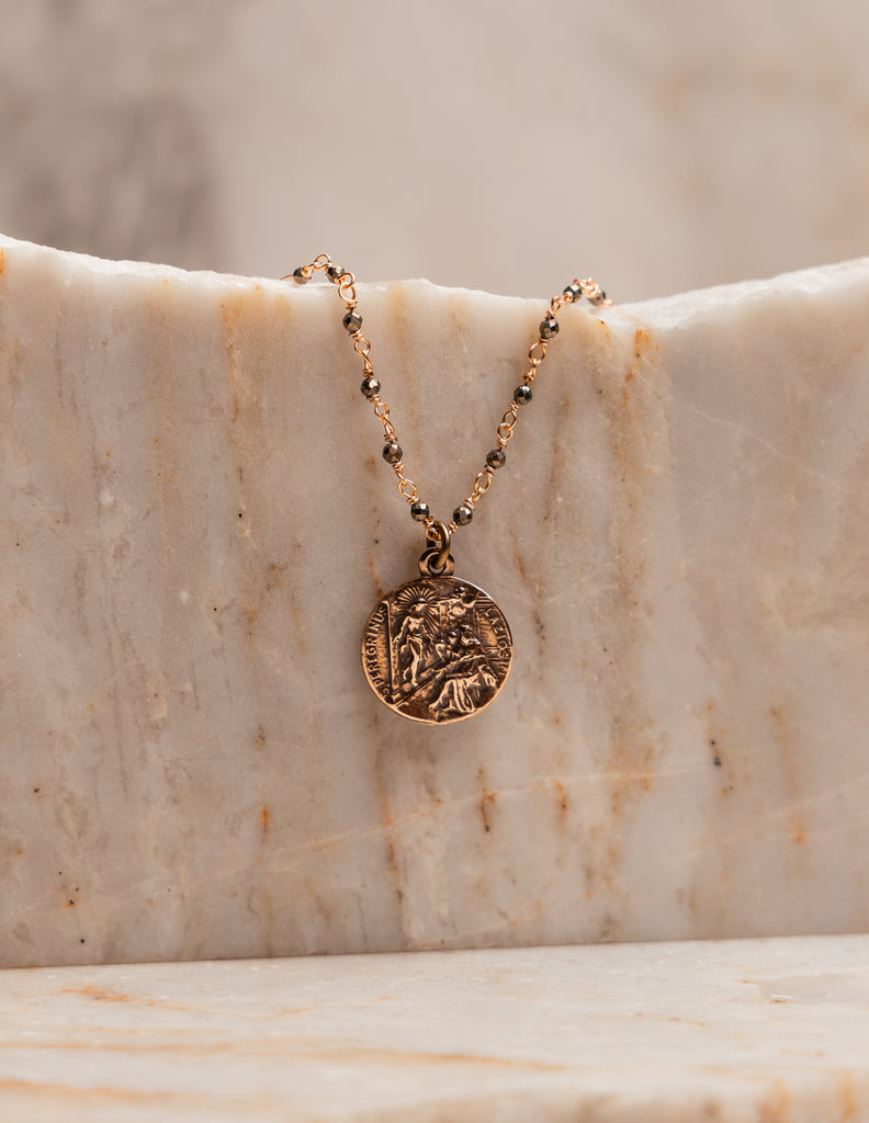 "Elegant Catholic jewelry - Miriam Necklace with vintage-style pyrite chain and sacred medal."

