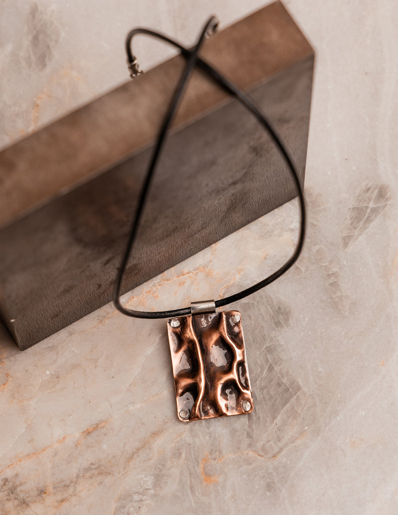 Unique copper and silver pendant on adjustable black Greek leather necklace