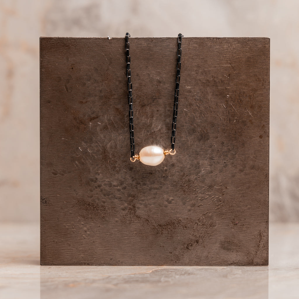 Contemporary mixed metal jewelry: oxidized silver and gold necklace with freshwater pearl