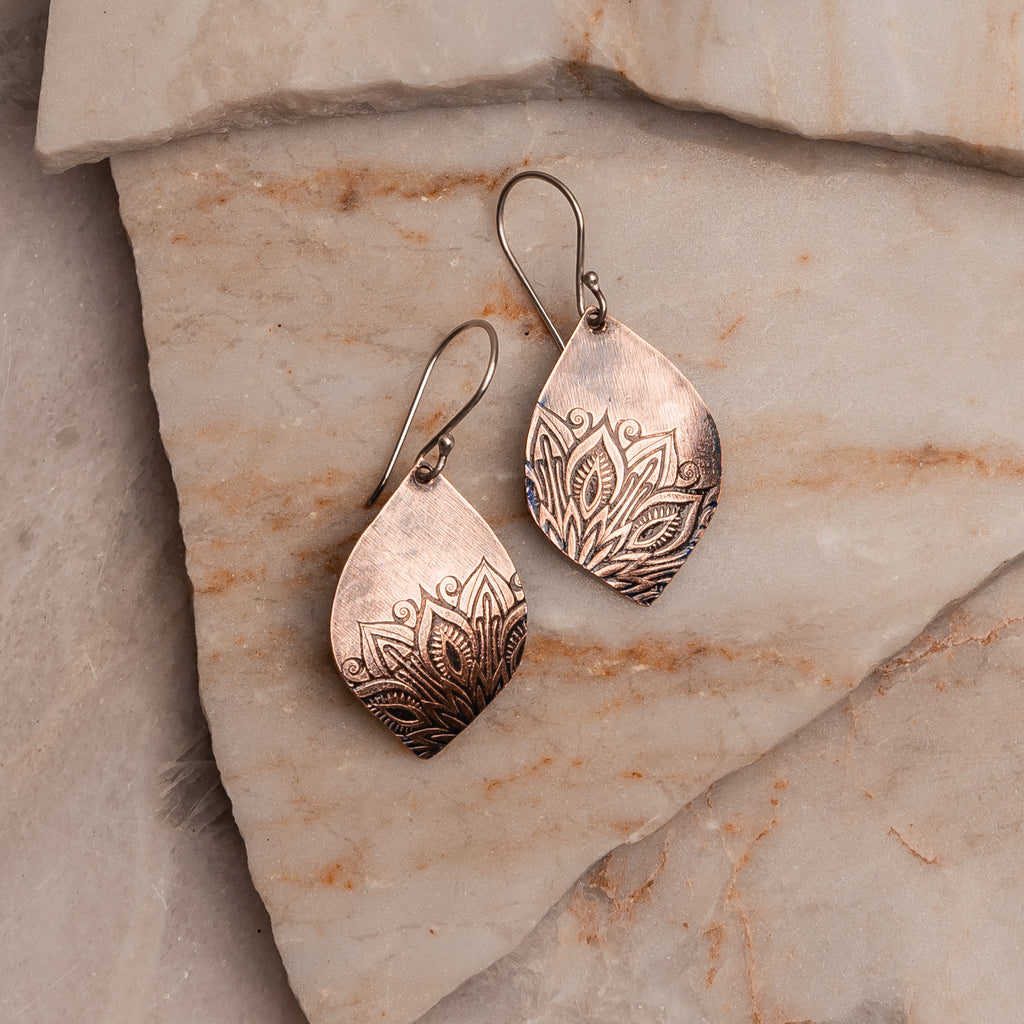 "Free-spirited copper earrings perfect for the modern bohemian soul seeker"