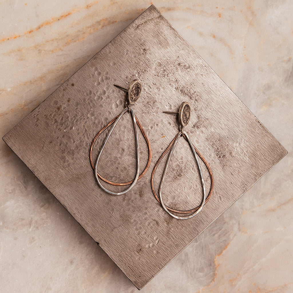 Artisanal Roxanna Earrings displaying unique metalwork with sterling silver and copper mixed metal design