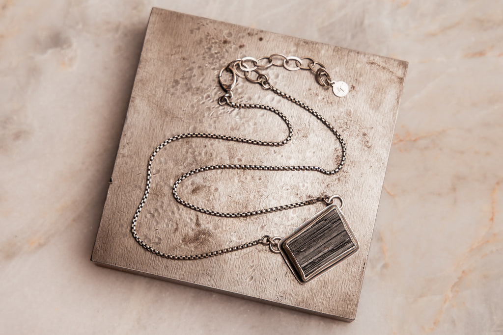 "Modern Sabine Necklace with a striking black tourmaline gemstone and sleek silver chain."

