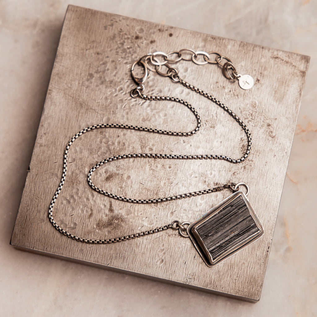 "Organic and edgy Sabine Necklace with black tourmaline, known as 'the stone of life.'"

