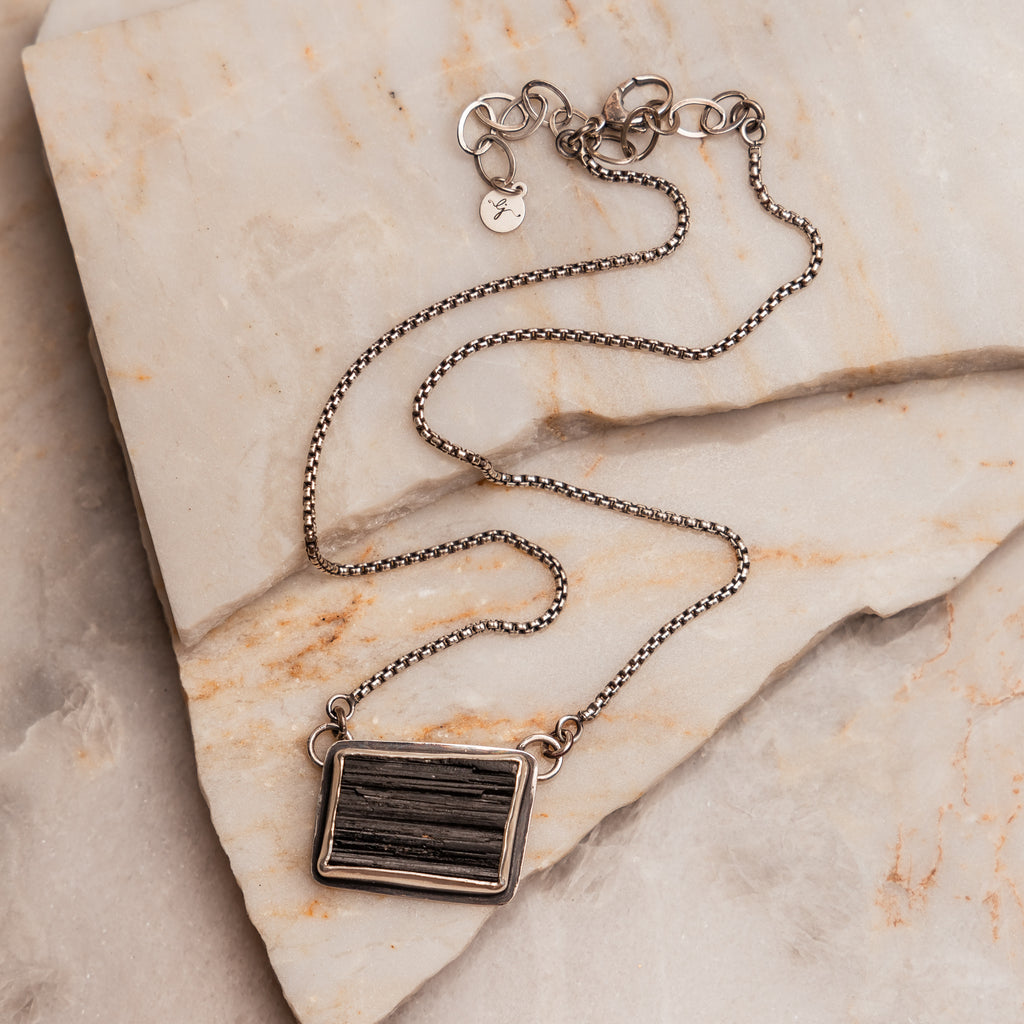 "Sabine Necklace featuring a unique black tourmaline druzy gemstone in a sterling silver setting."

