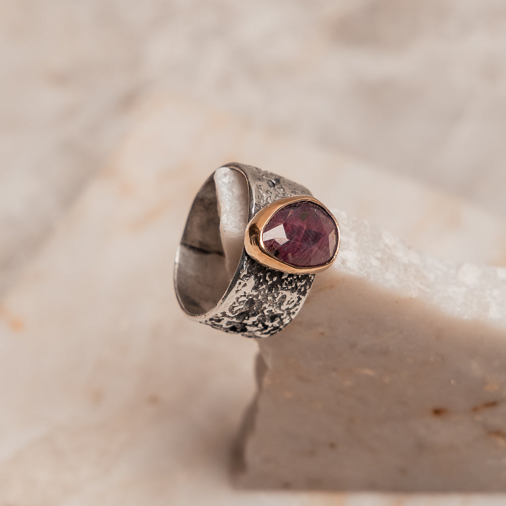 "Boho luxe ruby ring with organic textured silver band and 14k gold bezel - artisan statement jewelry for the modern free spirit"