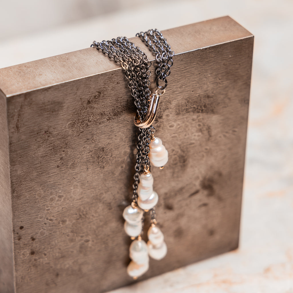 Calla Necklace: Dramatic dark chain with cascading white keshi pearls