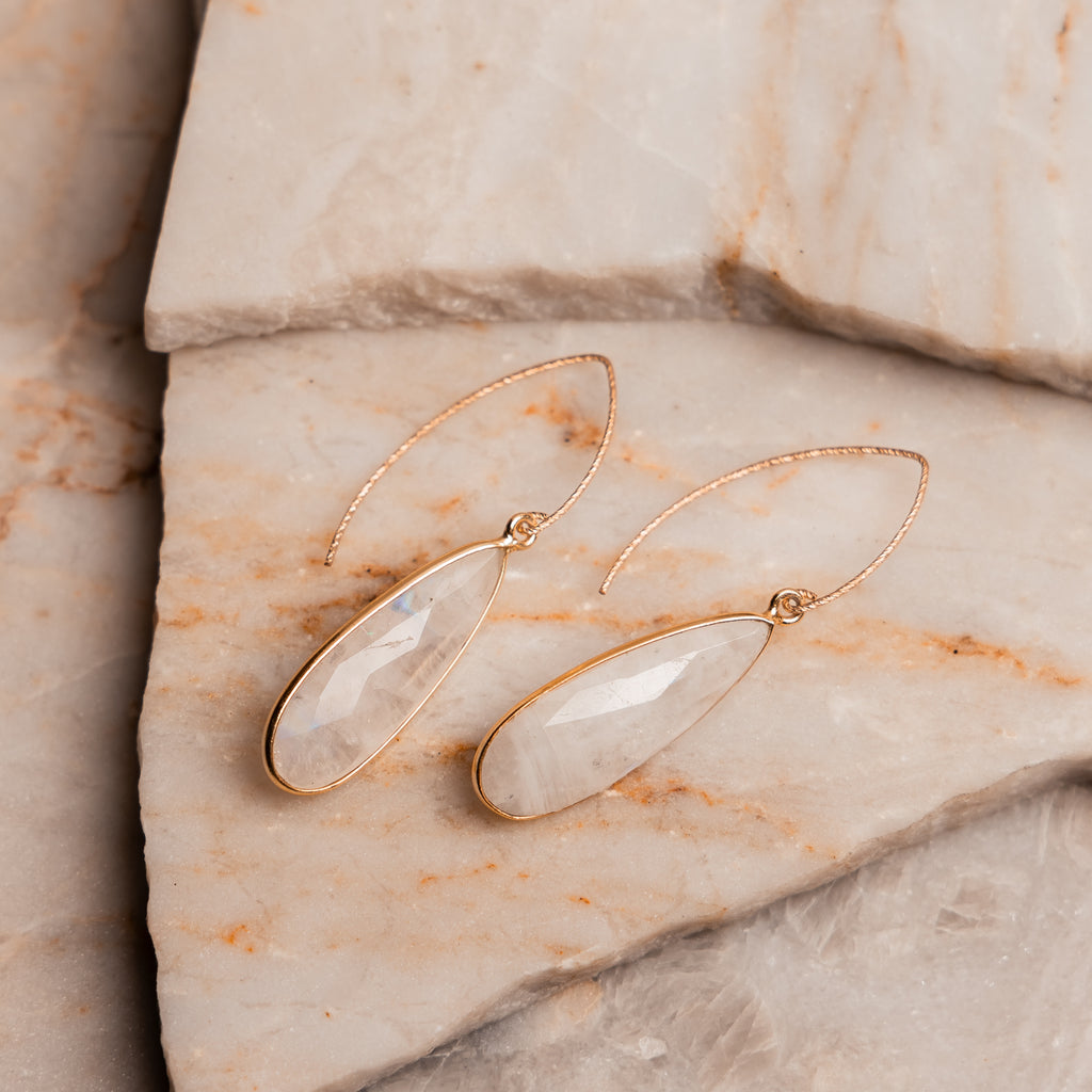 Contemporary gold earring design featuring moonstone