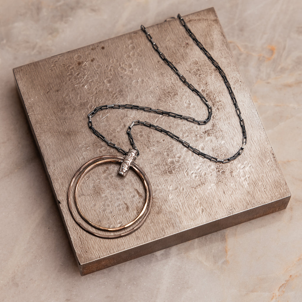 "Artisan-crafted Helena Necklace displaying the unique juxtaposition of shiny gold-filled and edgy oxidized sterling silver."

