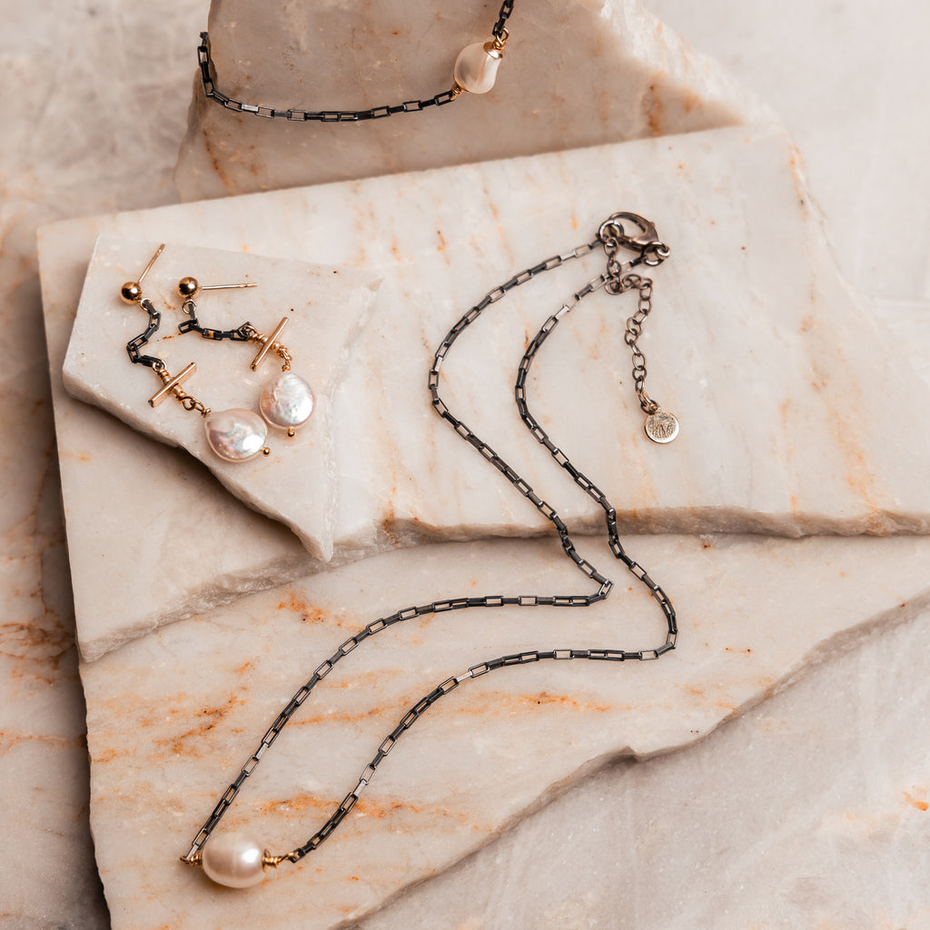 Contemporary mixed metal jewelry: oxidized silver and gold necklace with freshwater pearl