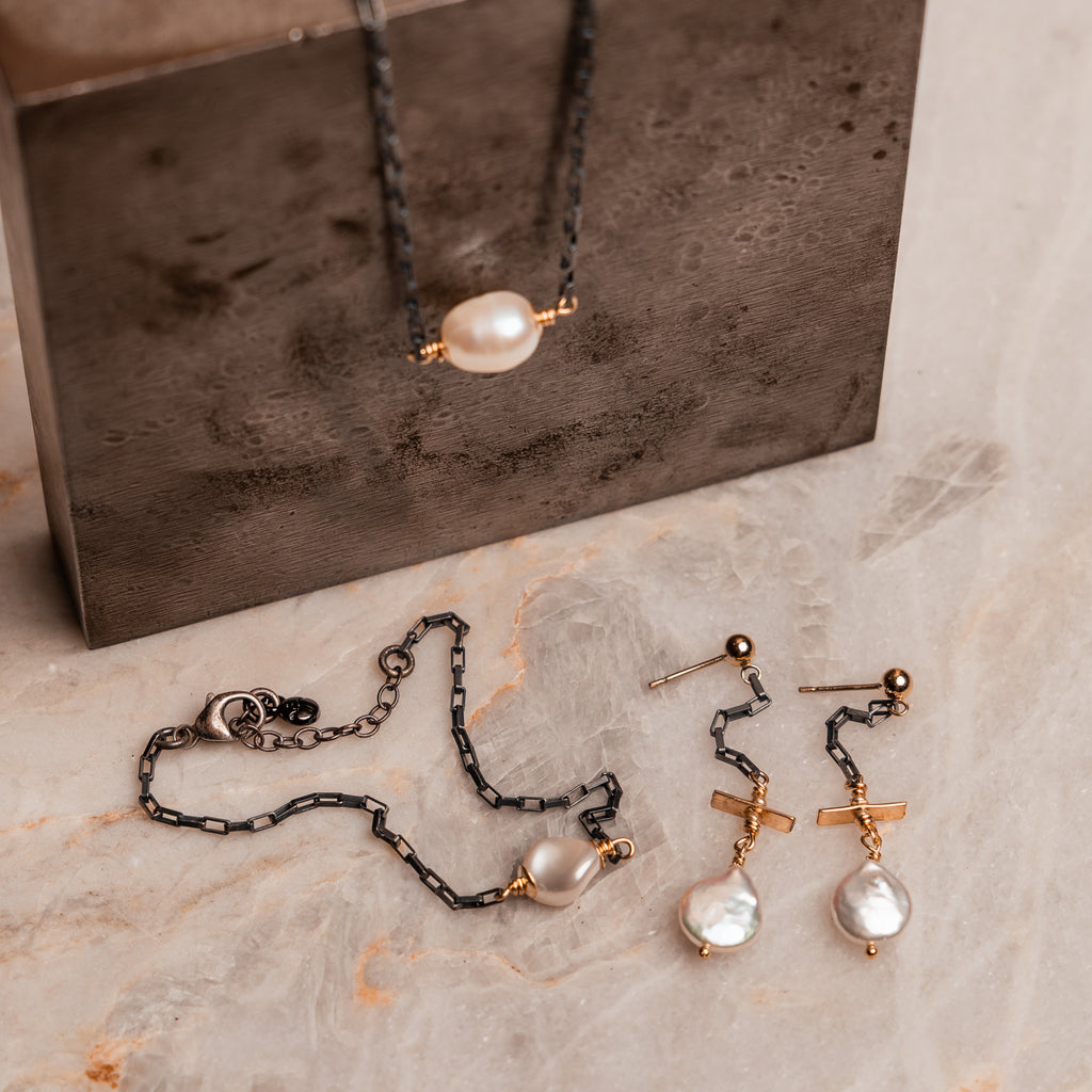 Unique beach-inspired jewelry with gold and freshwater pearl drops"